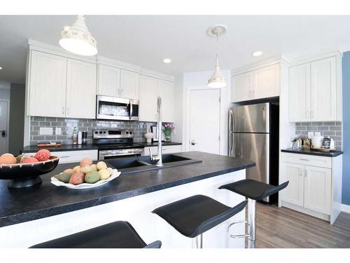 4310 Aspen Road, Coalhurst, AB - Indoor Photo Showing Kitchen With Stainless Steel Kitchen With Double Sink With Upgraded Kitchen