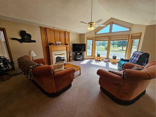 301 Centre Avenue, Milk River, AB - Indoor Photo Showing Living Room With Fireplace