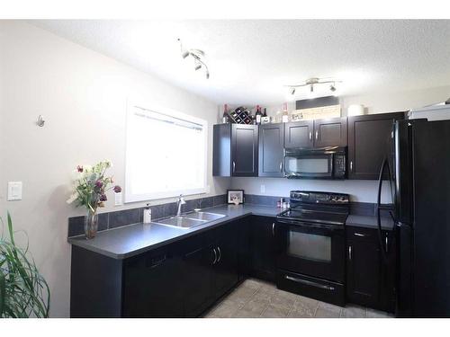 6-237 Silkstone Road West, Lethbridge, AB - Indoor Photo Showing Kitchen With Double Sink