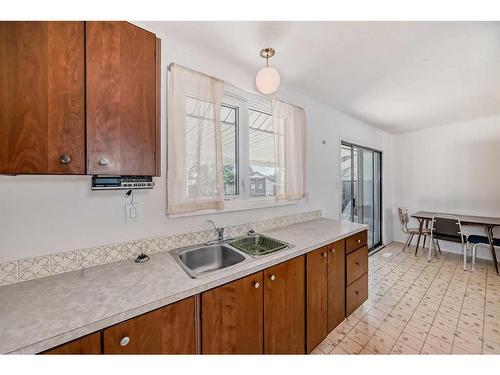 1205 St David Road North, Lethbridge, AB - Indoor Photo Showing Kitchen With Double Sink