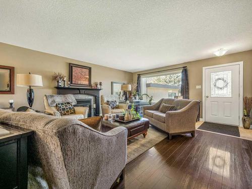 126 Ojibwa Place West, Lethbridge, AB - Indoor Photo Showing Living Room With Fireplace