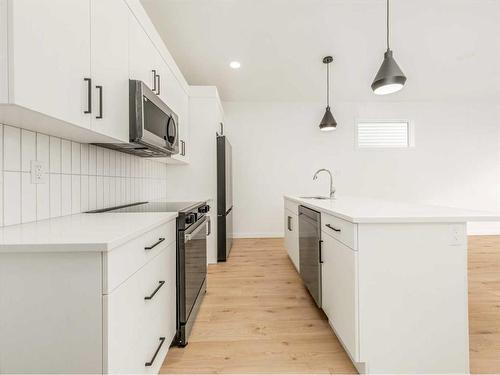 76 Blackwolf Lane North, Lethbridge, AB - Indoor Photo Showing Kitchen With Upgraded Kitchen