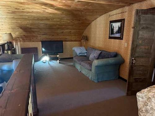 270002 Ab 505 Highway, Glenwood, AB - Indoor Photo Showing Living Room With Fireplace