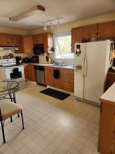 201 Centre Avenue, Milk River, AB - Indoor Photo Showing Kitchen With Double Sink