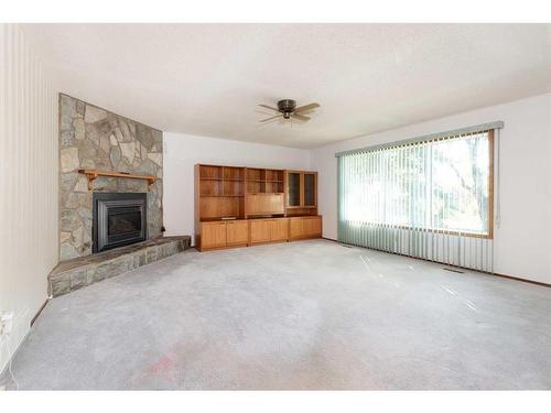 165 Purdue Court West, Lethbridge, AB - Indoor Photo Showing Other Room With Fireplace