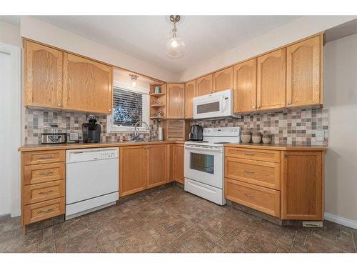 1102 20 Street North, Lethbridge, AB - Indoor Photo Showing Kitchen With Double Sink