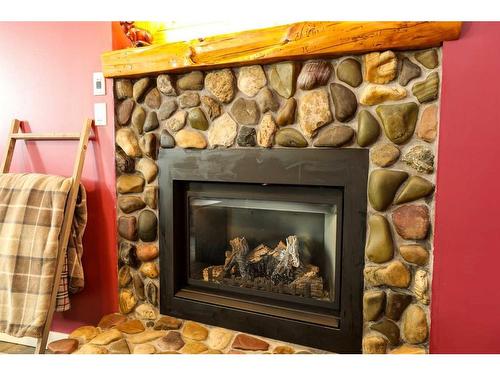 615 51 Avenue, Coalhurst, AB - Indoor Photo Showing Living Room With Fireplace