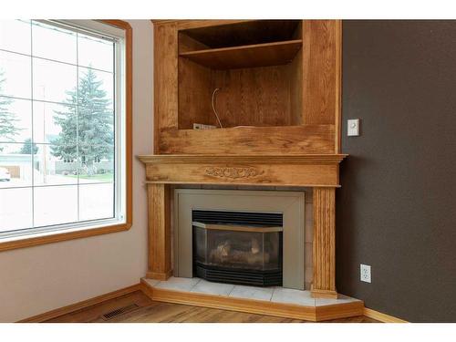 5407 52 Street, Taber, AB - Indoor Photo Showing Living Room With Fireplace