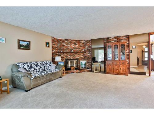 1118 Lakeland Crescent South, Lethbridge, AB - Indoor Photo Showing Living Room With Fireplace