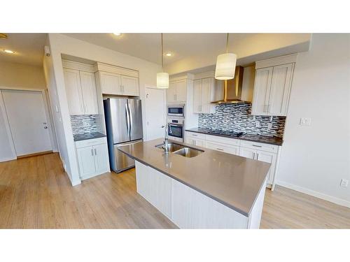 401 Devonia Way West, Lethbridge, AB - Indoor Photo Showing Kitchen With Stainless Steel Kitchen With Double Sink