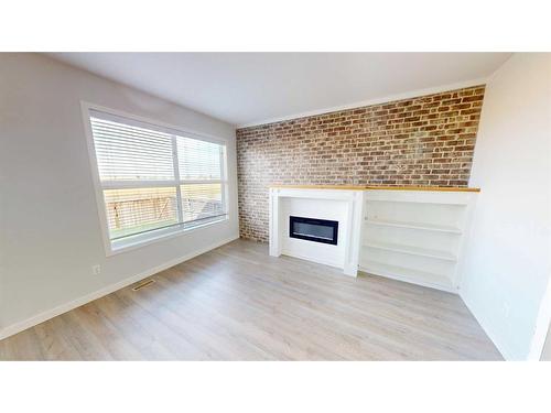 401 Devonia Way West, Lethbridge, AB - Indoor Photo Showing Other Room With Fireplace