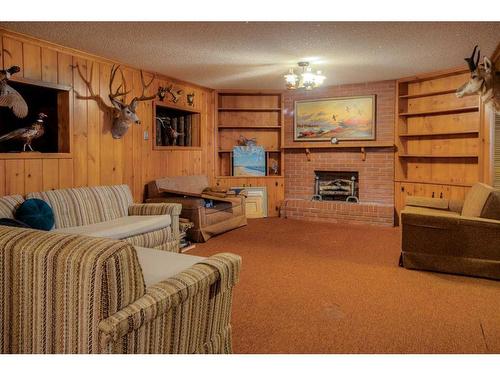 2808 South Parkside Drive South, Lethbridge, AB - Indoor Photo Showing Living Room With Fireplace