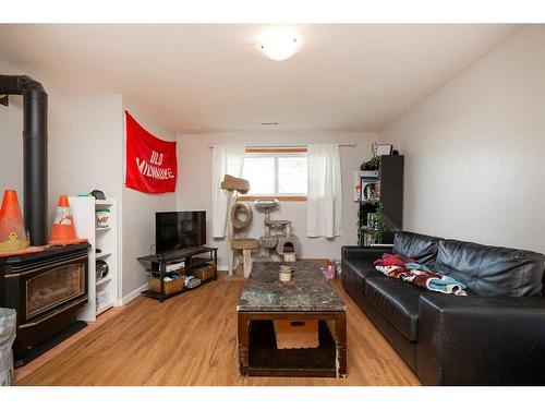 112 Mt Blakiston Road West, Lethbridge, AB - Indoor Photo Showing Living Room With Fireplace