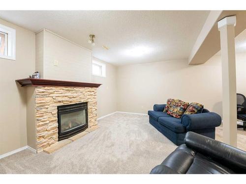 2007 15 Street, Coaldale, AB - Indoor Photo Showing Living Room With Fireplace