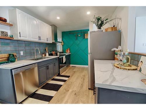 2414 14 Street North, Lethbridge, AB - Indoor Photo Showing Kitchen With Double Sink