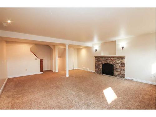 349 Leaside Avenue South, Lethbridge, AB - Indoor Photo Showing Living Room With Fireplace