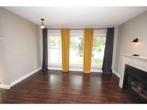 349 Leaside Avenue South, Lethbridge, AB - Indoor Photo Showing Living Room With Fireplace