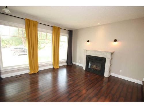 349 Leaside Avenue South, Lethbridge, AB - Indoor Photo Showing Living Room With Fireplace