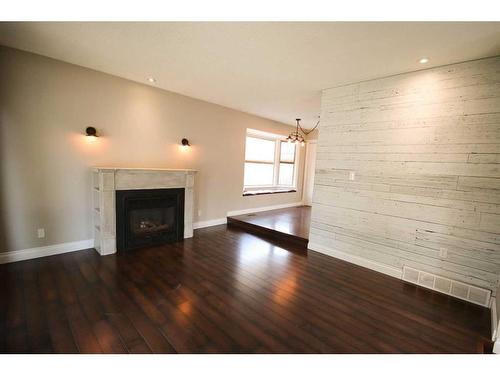 349 Leaside Avenue South, Lethbridge, AB - Indoor Photo Showing Living Room With Fireplace