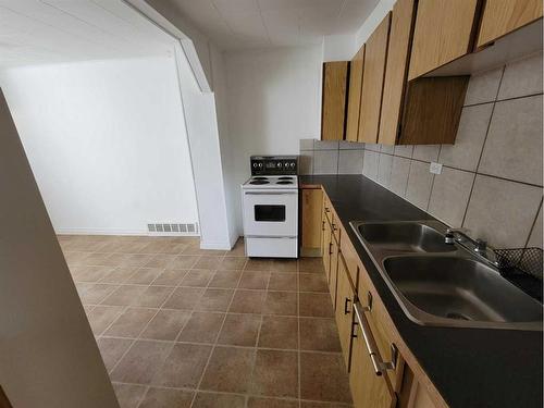 137 14 Street North, Lethbridge, AB - Indoor Photo Showing Kitchen With Double Sink