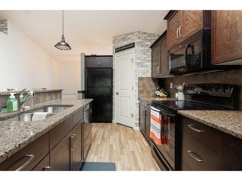 254 Firelight Crescent West, Lethbridge, AB - Indoor Photo Showing Kitchen With Double Sink