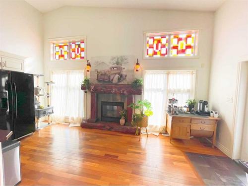 4330 4Th Avenue South, Lethbridge, AB - Indoor Photo Showing Living Room With Fireplace