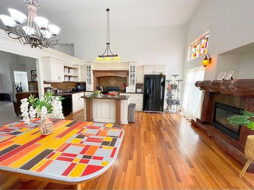 4330 4Th Avenue South, Lethbridge, AB - Indoor Photo Showing Dining Room With Fireplace