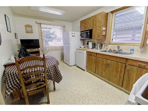 1038 Great Lakes Road South, Lethbridge, AB - Indoor Photo Showing Kitchen With Double Sink