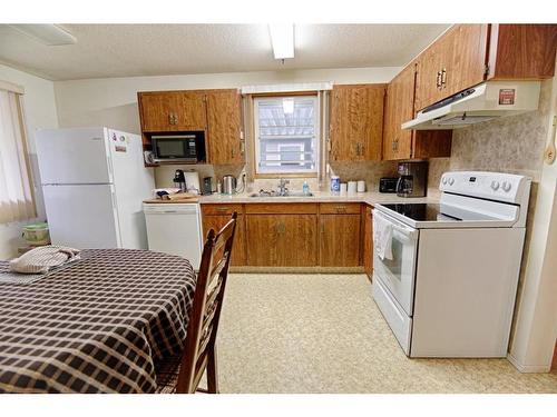 1038 Great Lakes Road South, Lethbridge, AB - Indoor Photo Showing Kitchen With Double Sink