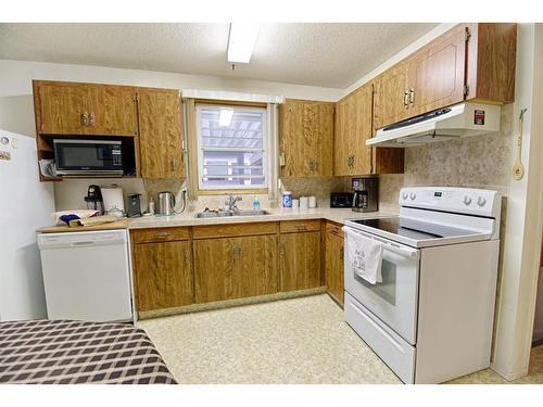 1038 Great Lakes Road South, Lethbridge, AB - Indoor Photo Showing Kitchen With Double Sink