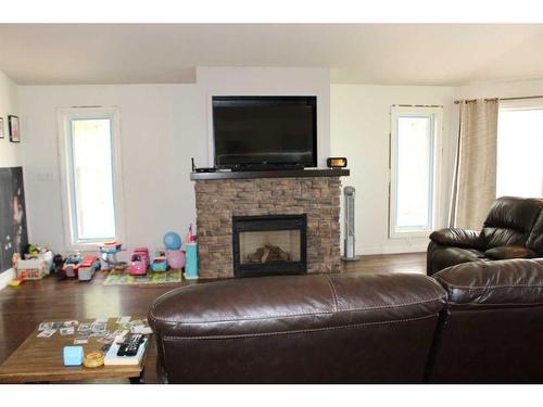 110046 Rg Rd 205, Picture Butte, AB - Indoor Photo Showing Living Room With Fireplace