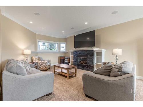 2609 Aspen Drive, Coaldale, AB - Indoor Photo Showing Living Room With Fireplace