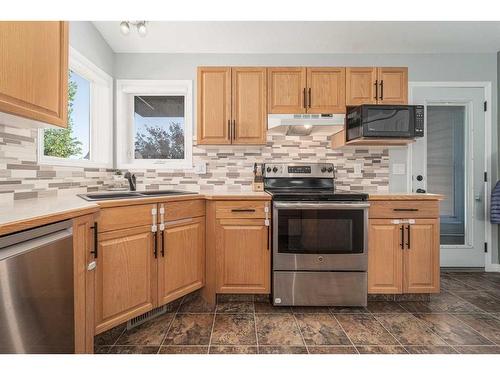 35 Squamish Boulevard West, Lethbridge, AB - Indoor Photo Showing Kitchen With Double Sink