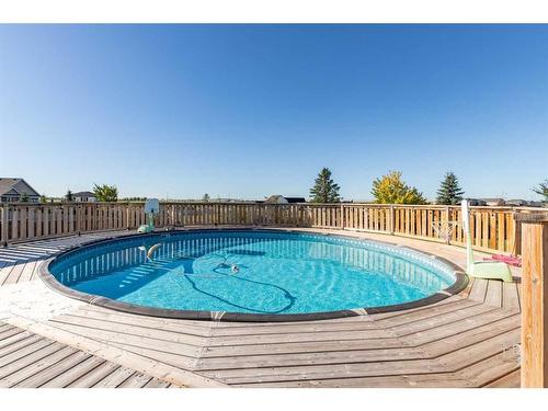 409 Arbourwood Terrace South, Lethbridge, AB - Outdoor With Above Ground Pool With Deck Patio Veranda With Backyard