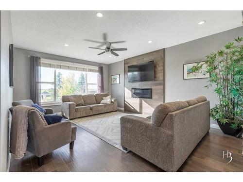 409 Arbourwood Terrace South, Lethbridge, AB - Indoor Photo Showing Living Room With Fireplace