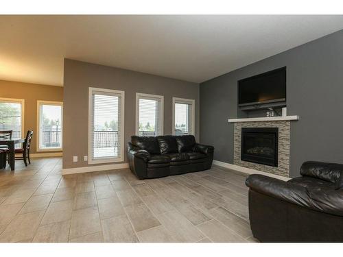 523 Firelight Place West, Lethbridge, AB - Indoor Photo Showing Living Room With Fireplace