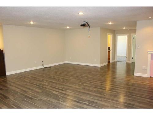 751 Northridge Street, Picture Butte, AB - Indoor Photo Showing Other Room With Fireplace