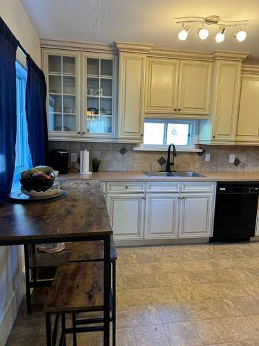 677 Frederick Street, Pincher Creek, AB - Indoor Photo Showing Kitchen With Double Sink