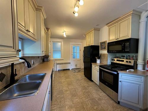 677 Frederick Street, Pincher Creek, AB - Indoor Photo Showing Kitchen With Double Sink