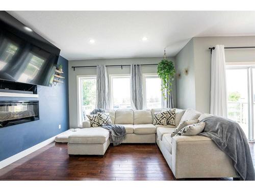 526 Twinriver Road West, Lethbridge, AB - Indoor Photo Showing Living Room With Fireplace