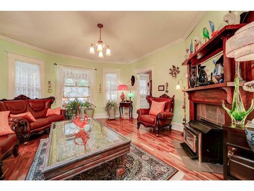 633 5 Street South, Lethbridge, AB - Indoor Photo Showing Living Room With Fireplace