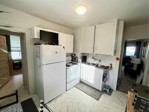 314 15 Street North, Lethbridge, AB - Indoor Photo Showing Kitchen With Double Sink