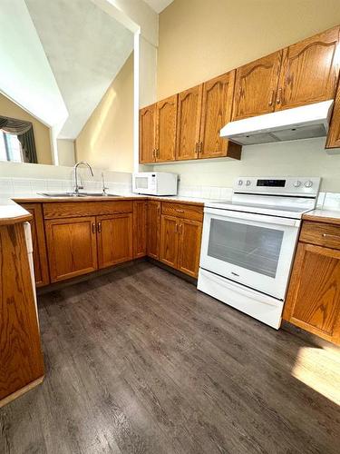 228 Mt Blakiston Road West, Lethbridge, AB - Indoor Photo Showing Kitchen With Double Sink