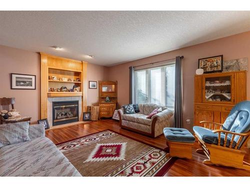 16 Rivercrest Court West, Lethbridge, AB - Indoor Photo Showing Living Room With Fireplace