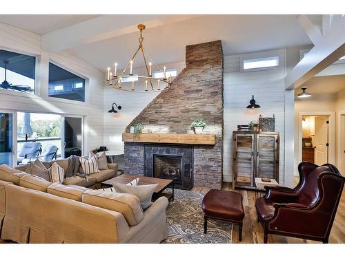 676 Lakeside Drive, Rural Vulcan County, AB - Indoor Photo Showing Living Room With Fireplace