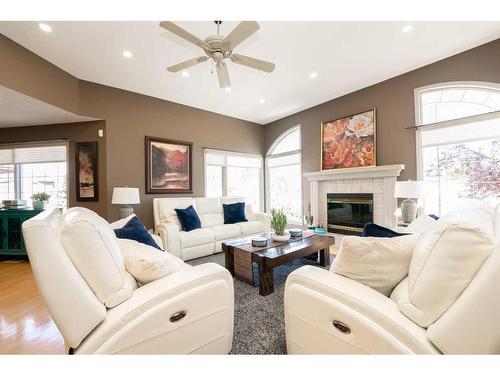 103 Canyon Terrace West, Lethbridge, AB - Indoor Photo Showing Living Room With Fireplace