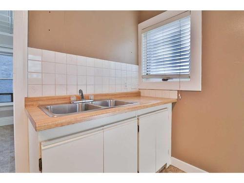 640 7 Street South, Lethbridge, AB - Indoor Photo Showing Kitchen With Double Sink