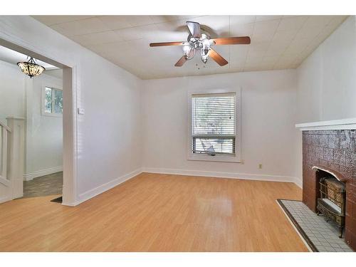 640 7 Street South, Lethbridge, AB - Indoor Photo Showing Other Room With Fireplace