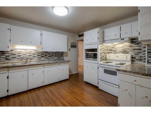 612 12 Street South, Lethbridge, AB - Indoor Photo Showing Kitchen With Double Sink