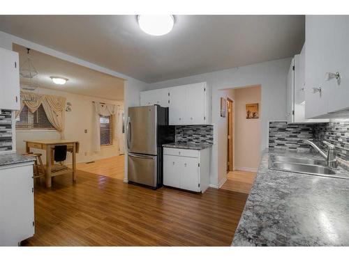 612 12 Street South, Lethbridge, AB - Indoor Photo Showing Kitchen With Double Sink